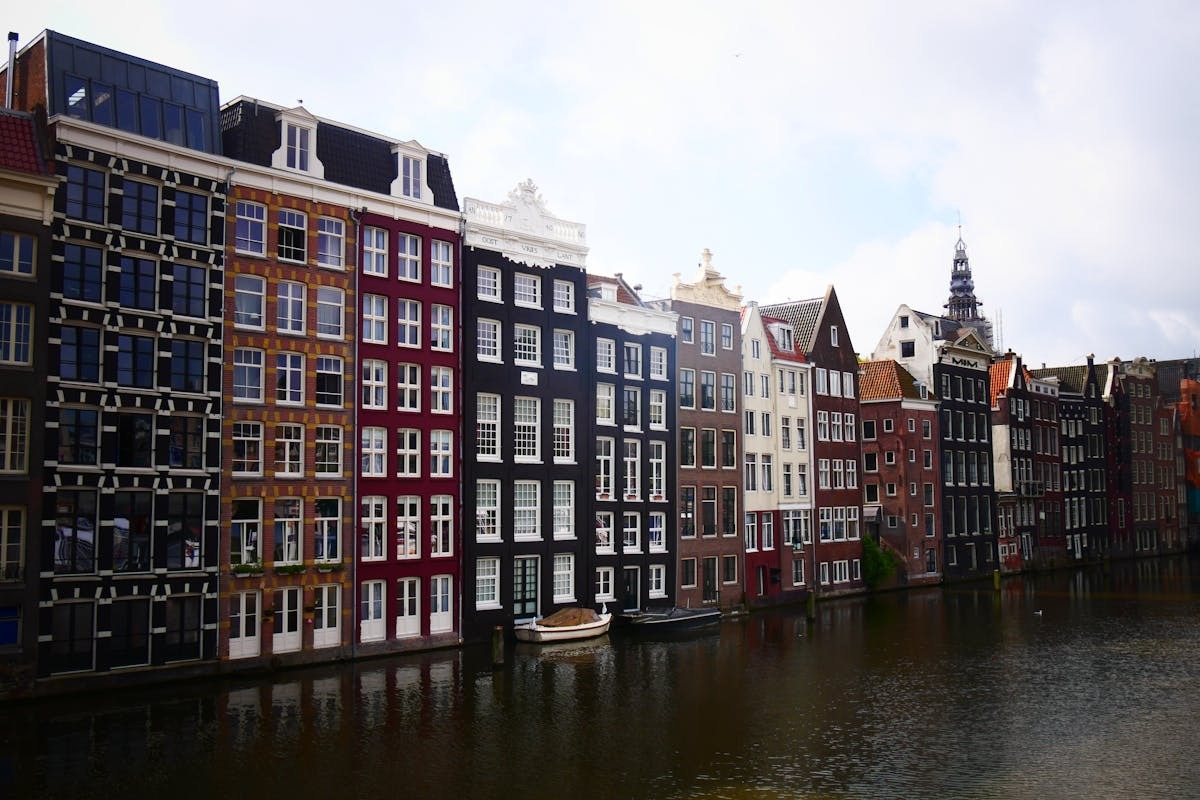 Amsterdam canal houses along the Amstel river in the Netherlands
