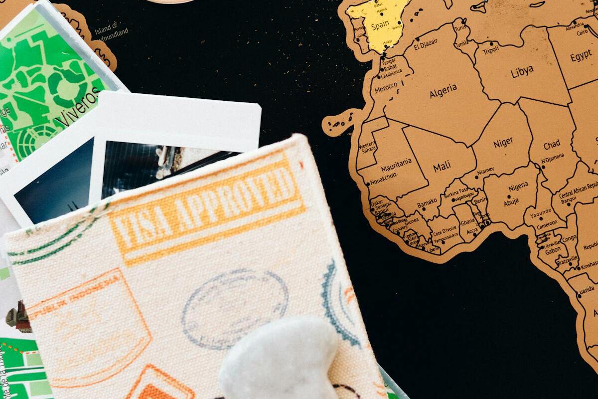 US passport with travel photos and world map for expat life abroad