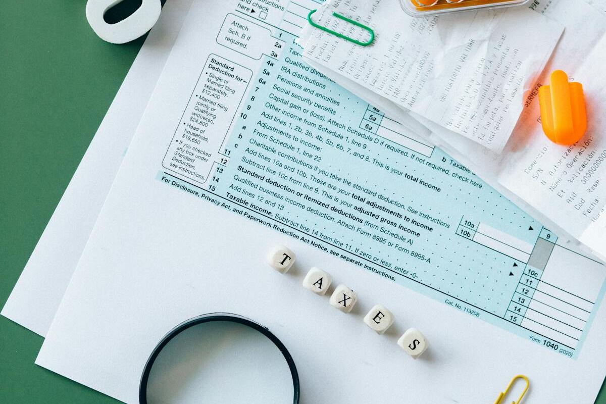 Tax documents, calculator, and financial paperwork representing US expat compliance requirements