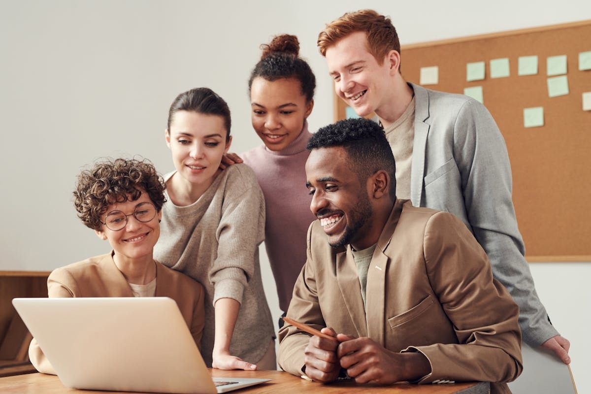 US expat working remotely on laptop, managing student loans and finances from abroad