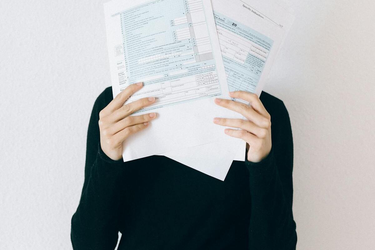 Woman stressed over tax paperwork - FATCA reporting creates enormous compliance burden for American expats