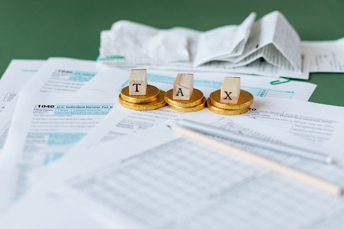 Tax documents on desk representing FBAR and FATCA reporting obligations for US expats