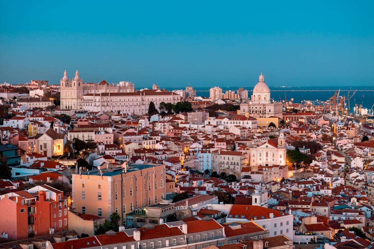 Cityscape of Lisbon Portugal with historic tiled buildings and terracotta rooftops