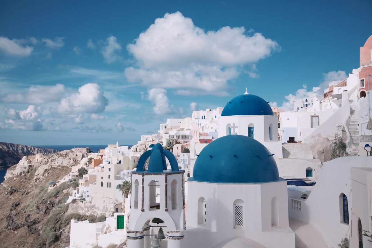 Santorini Greece white buildings and blue domes - iconic Mediterranean retirement destination