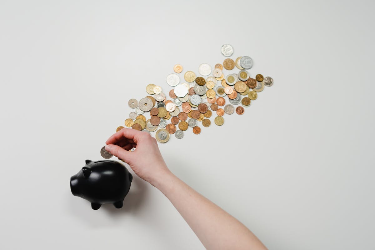 Glass jar of coins representing retirement savings and wealth building for expats living abroad