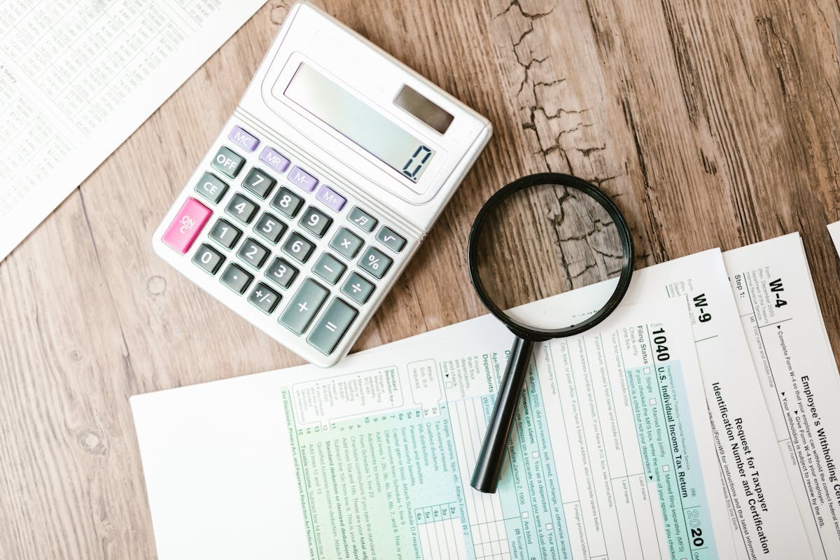Tax documents and calculator representing Spain Beckham Law financial planning for expats
