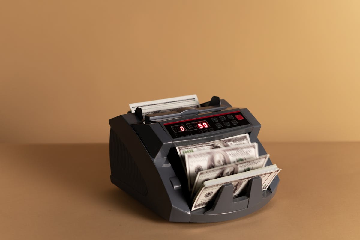 US dollar banknotes in a money counter representing remittance transfers and international banking