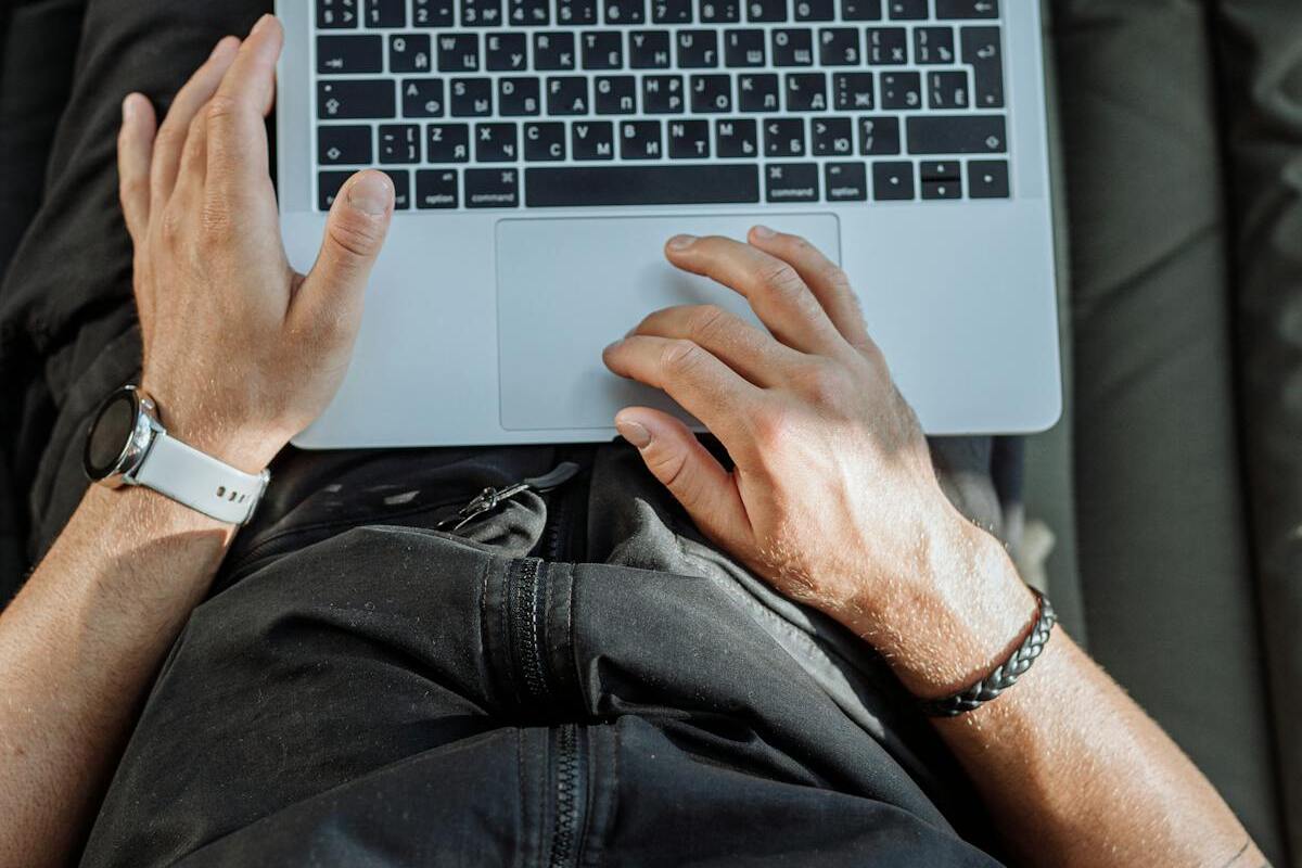 Person working on laptop representing digital nomad state tax planning