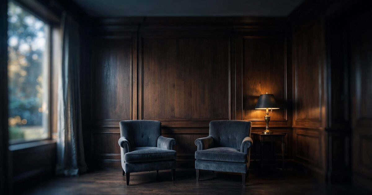 Quiet walnut parlor with empty chairs and morning window light