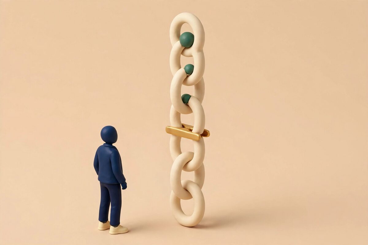 A paper chain of six loops with beads in the first three only