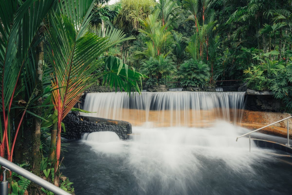 Tabacon Hot Springs waterfall surrounded by lush Costa Rica rainforest