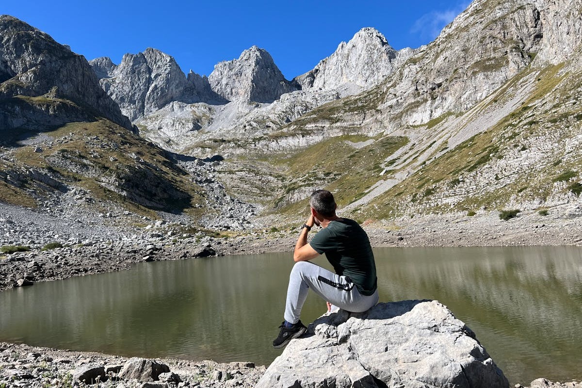 Hiker in Albanian mountain landscape — the outdoor lifestyle accessible to digital nomads in Albania