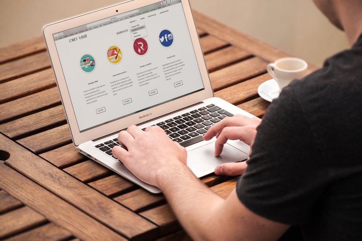 Person working on MacBook remotely — affiliate marketing and SEO work setup