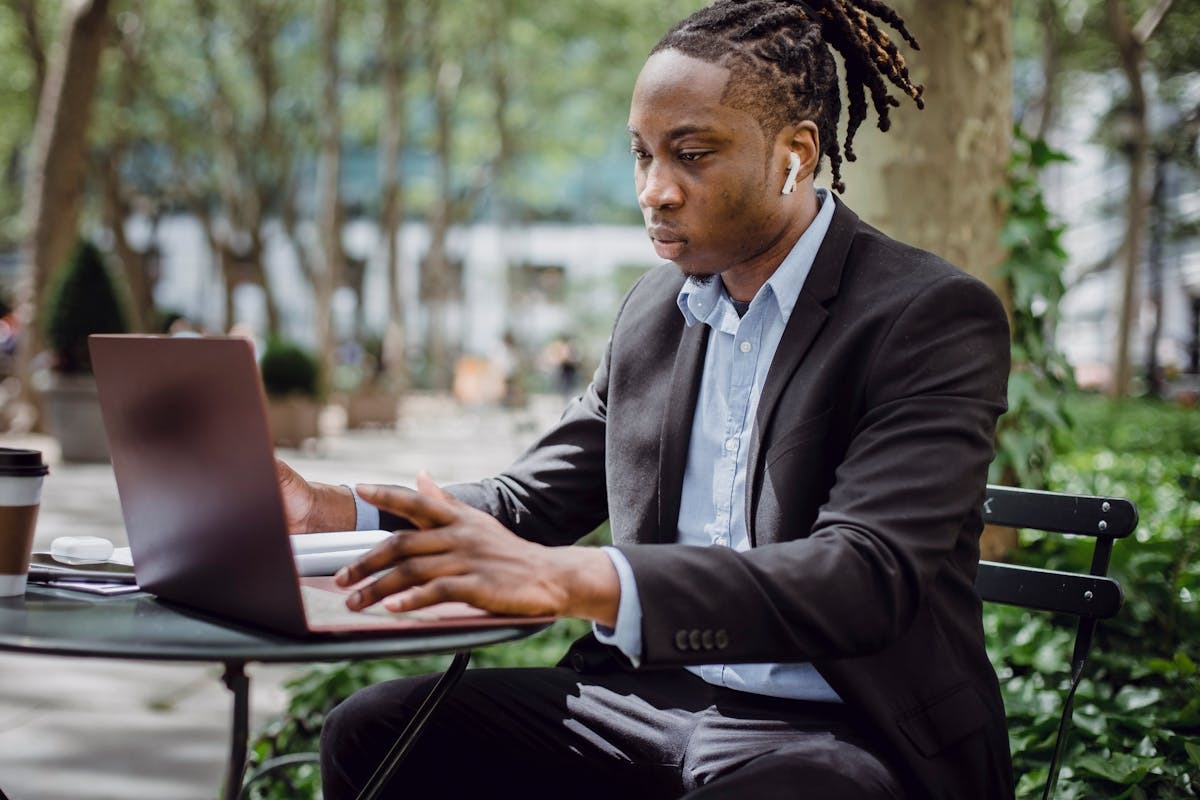 Remote worker analyzing data at outdoor cafe — the daily reality of expat life in Australia